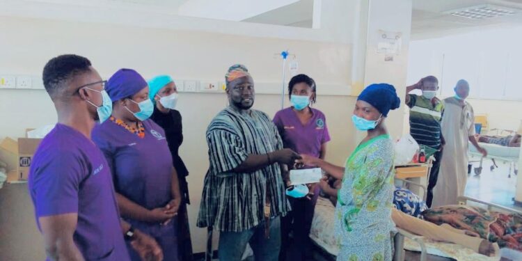 Mohammed Ali receives a GHC5,000 cheque support from Wipe Away Foundation at Tamale Teaching Hospital (TTH).