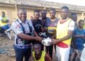 Aspiring NPP youth organizer presents footballs, cash and shinguards to Mole Nationals FC