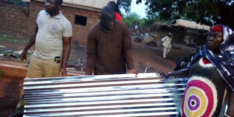 Former member of parliament for Salaga South Donates  packets of roofing sheets to victims of Kumabuye and Masaka rainstorm.